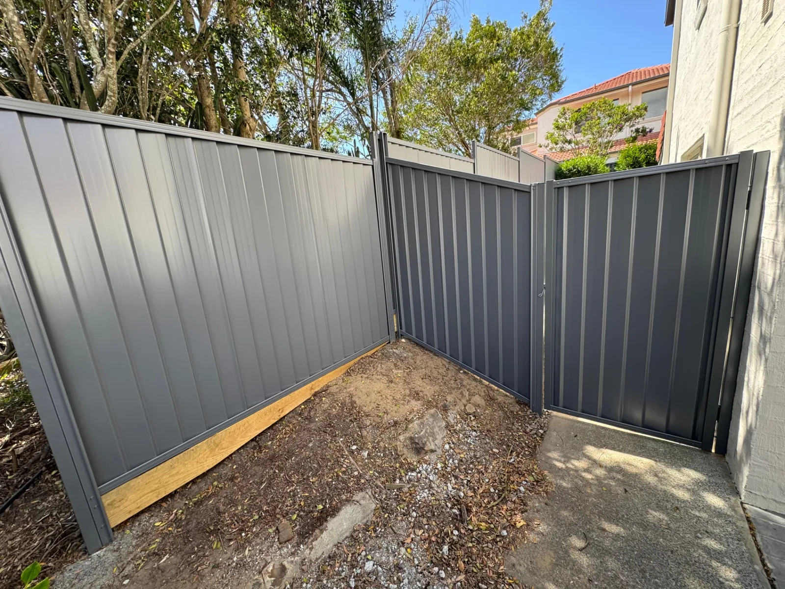 Colorbond corner fencing and access gate in Wynnum West