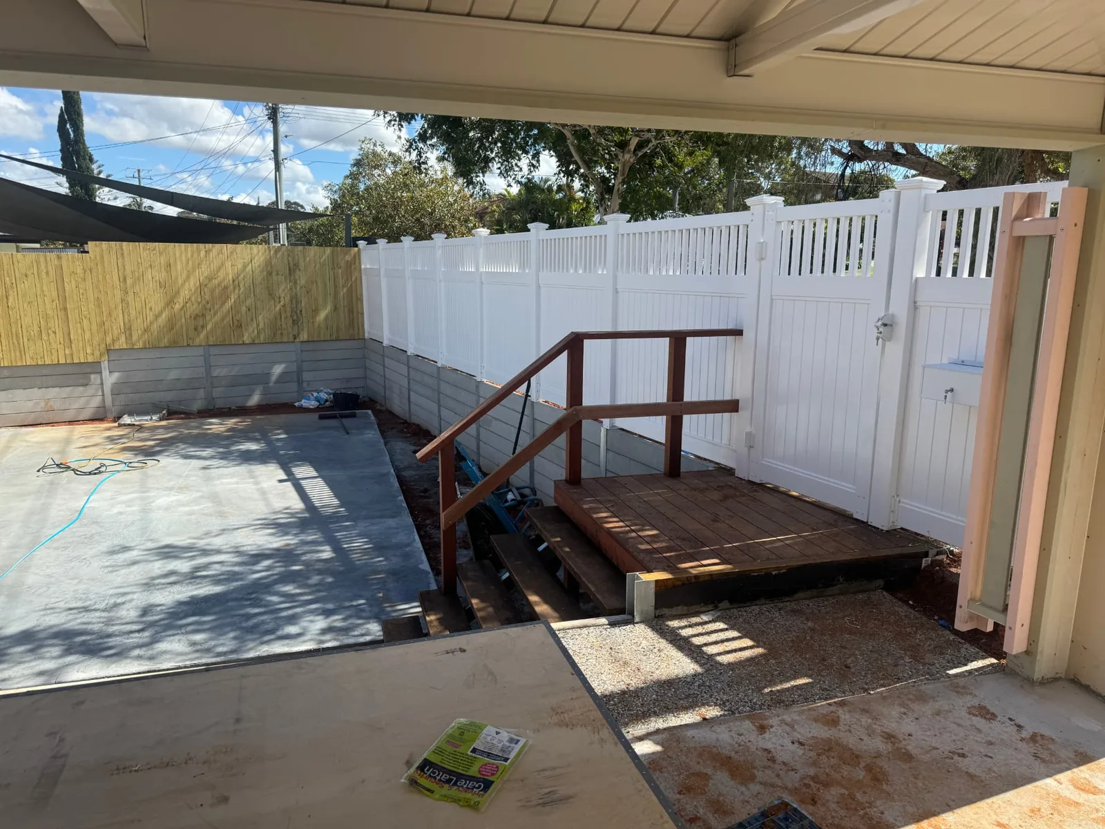 Concrete retaining walls, PVC fencing and timber access stairs
