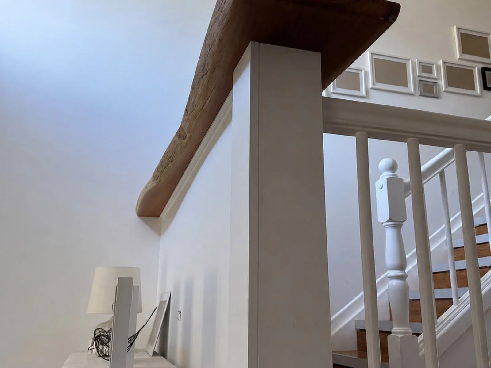 Custom timber staircase feature viewed from the upper level