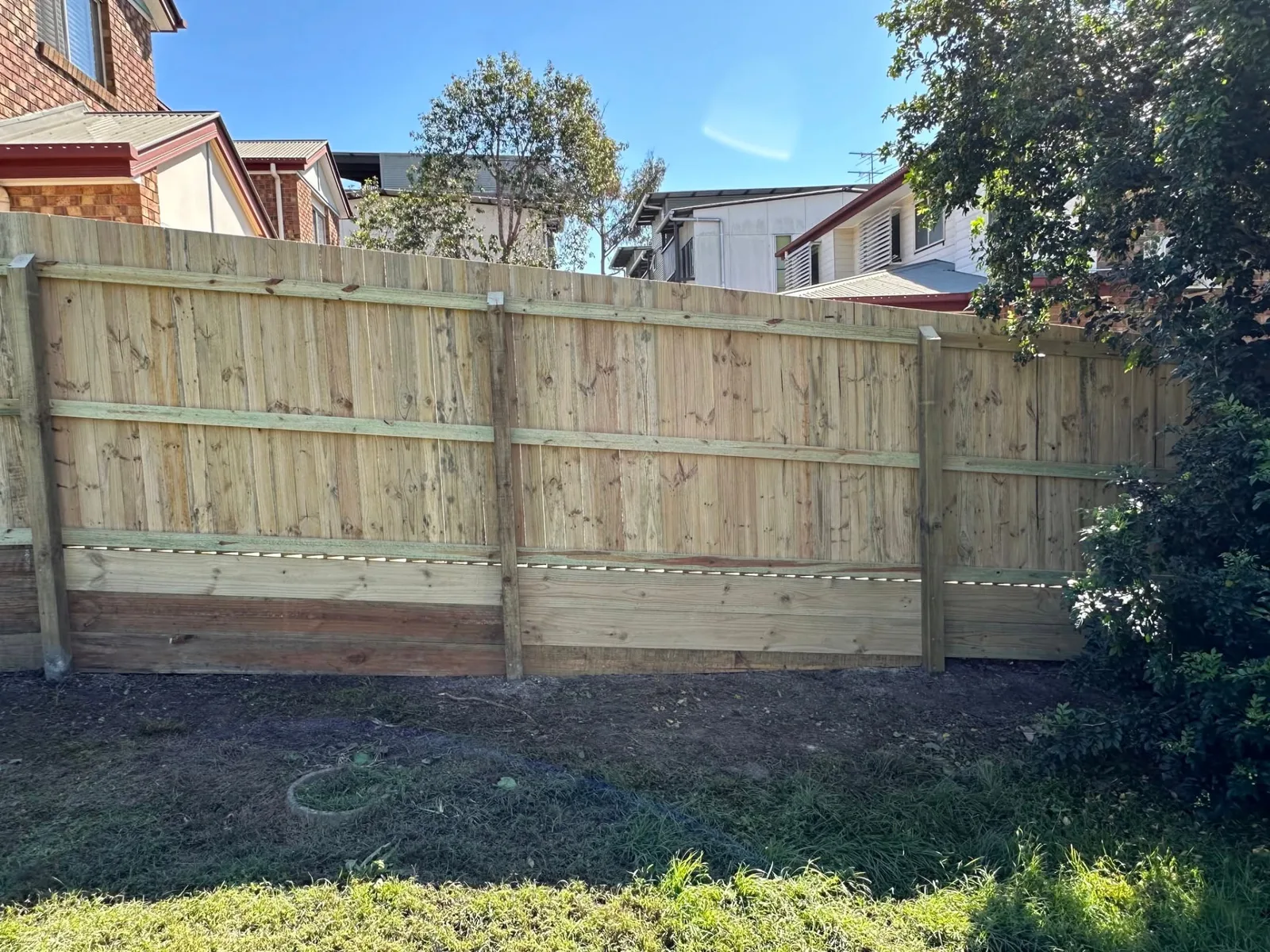 Rear view of timber boundary fence installation in Morningside QLD