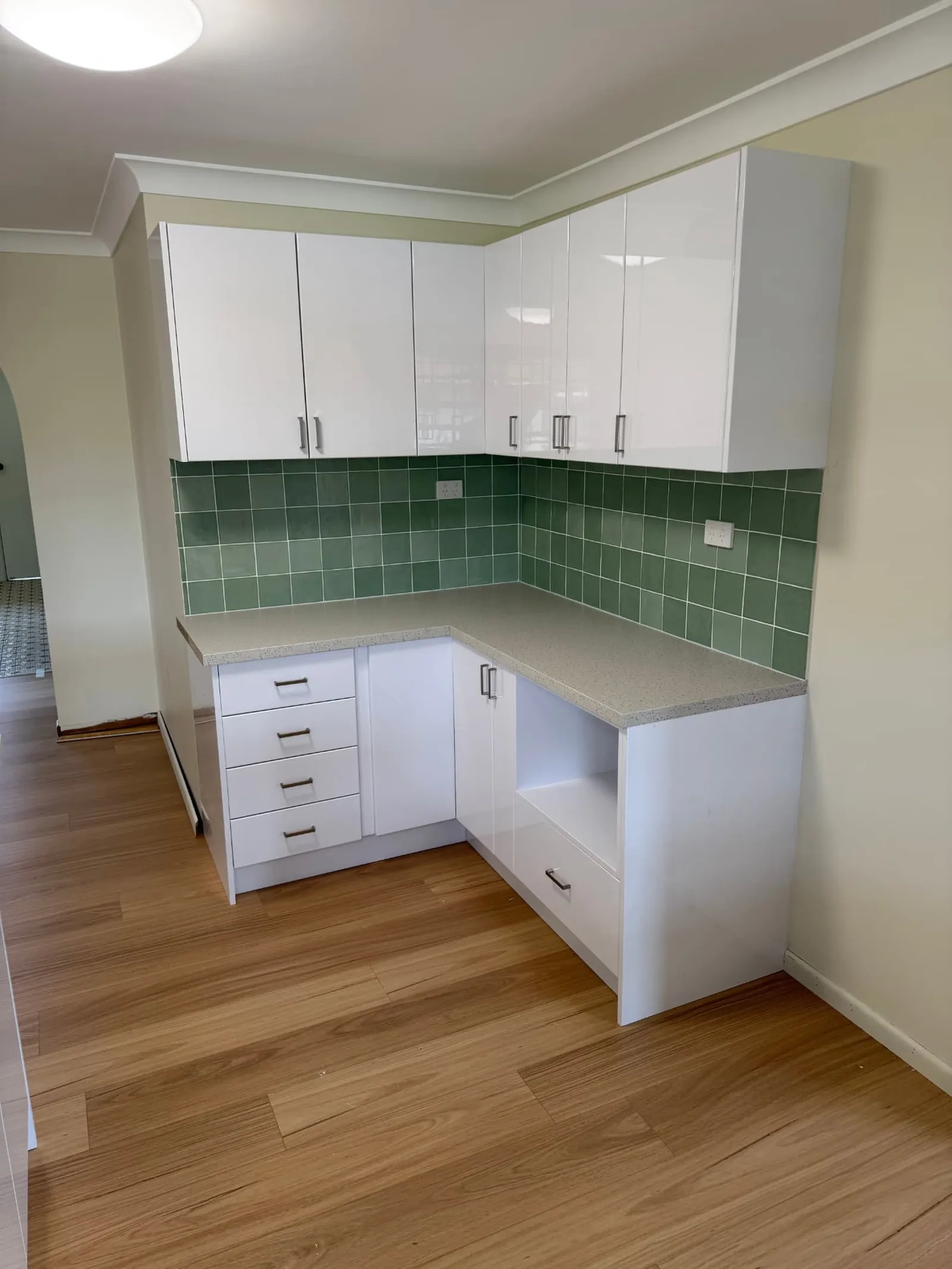 Secondary kitchen cabinetry with drawers and stone-look benchtop in Carindale