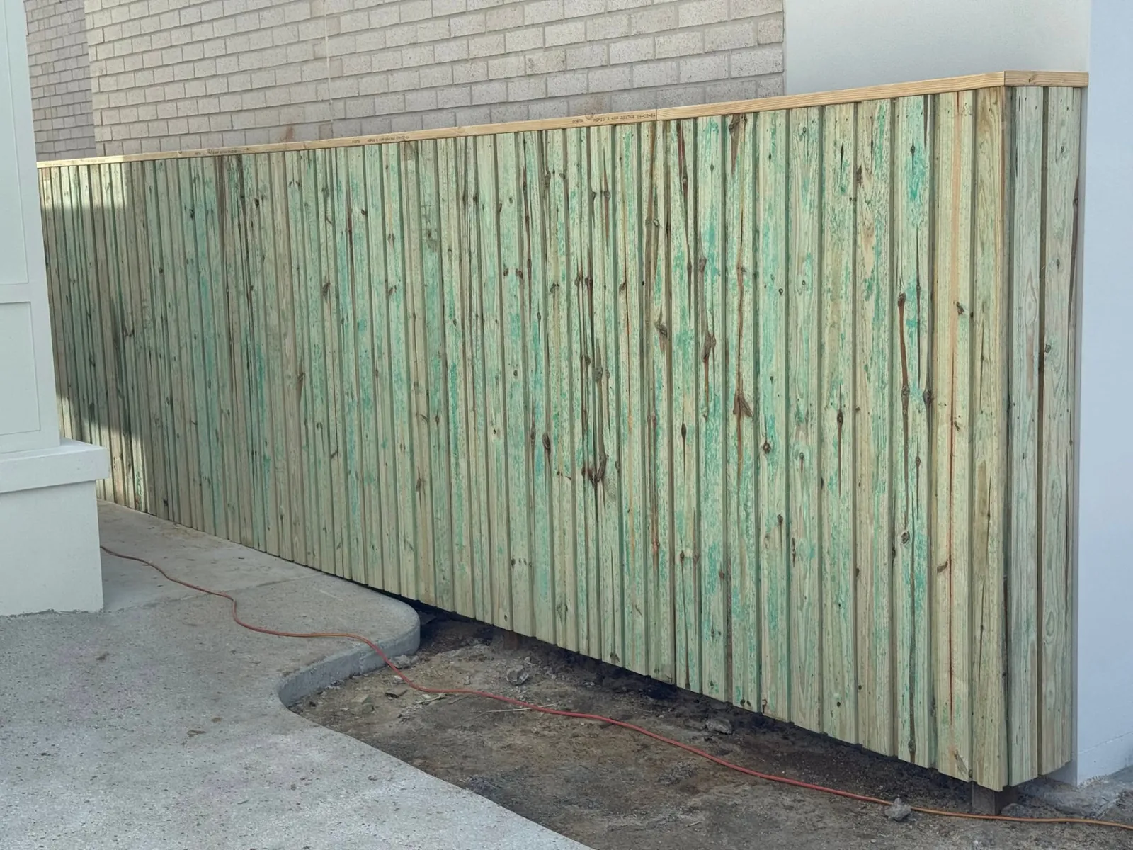 Low timber privacy screen fencing beside the home in Wynnum