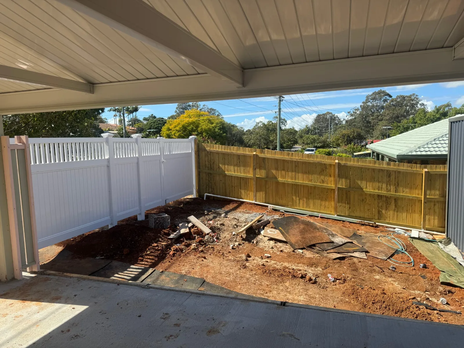 Timber boundary fence adjoining East Hampton PVC fencing