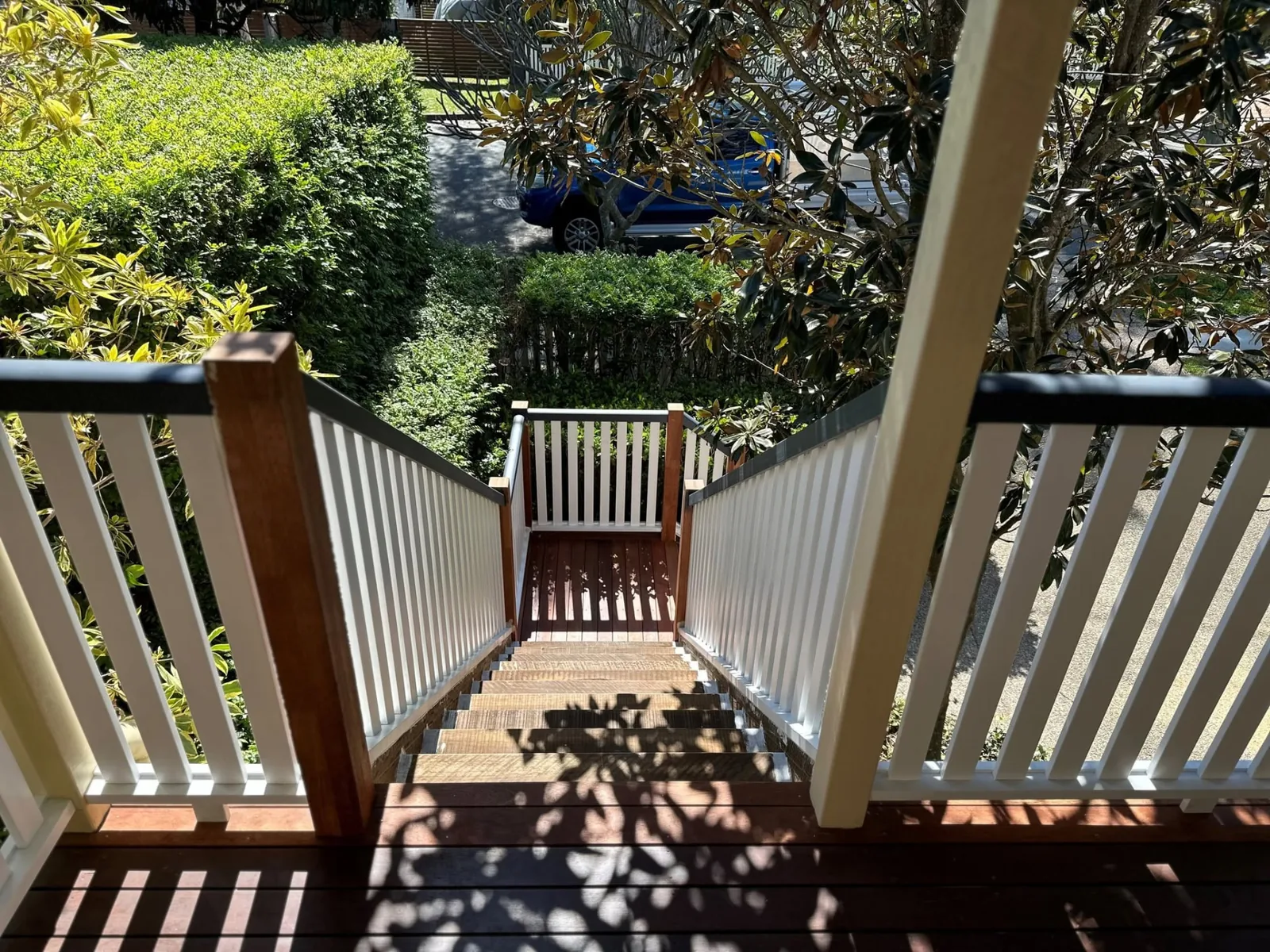 Timber staircase with white balustrades at a Norman Park home