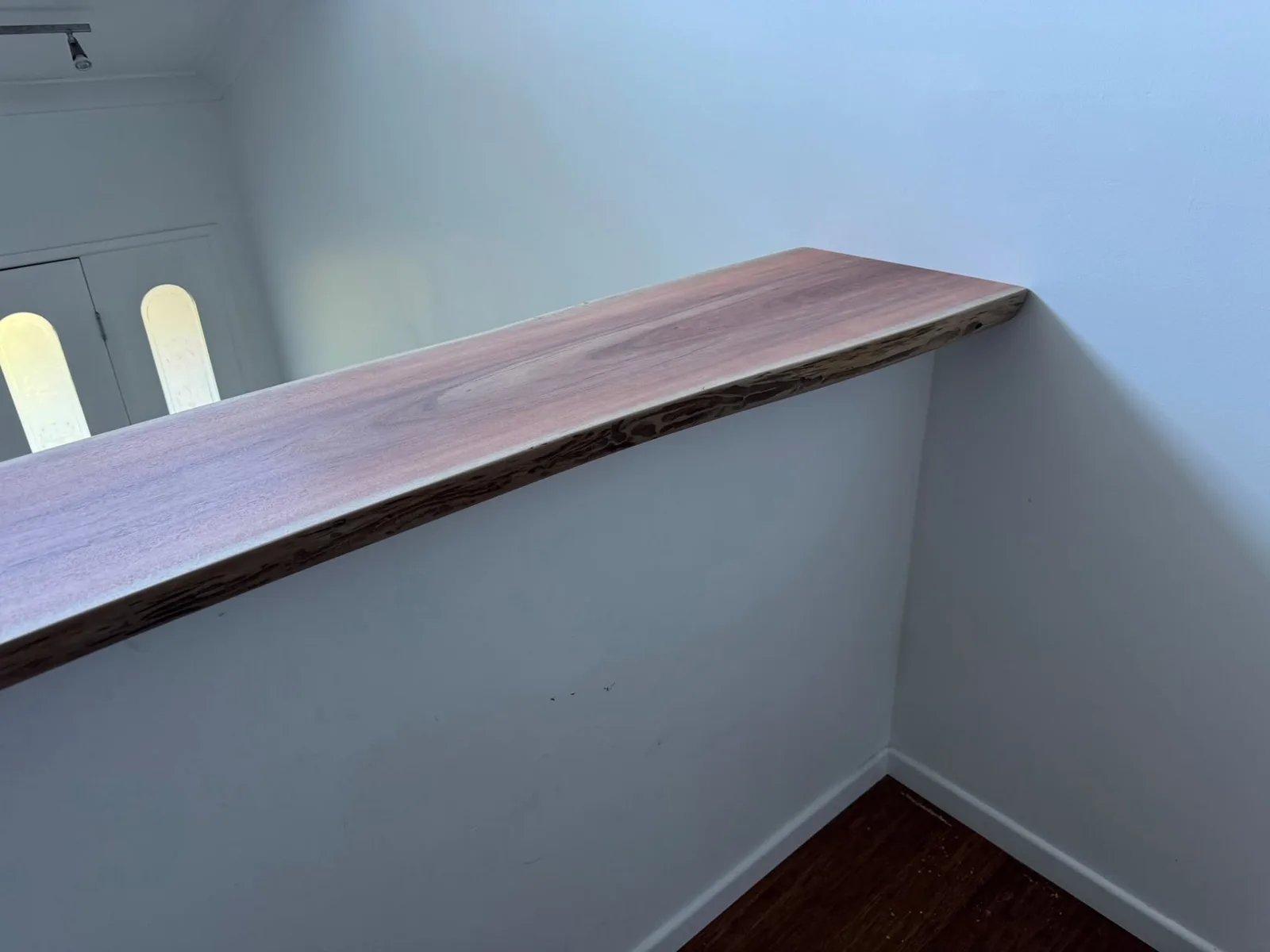 Natural edge detail on custom timber staircase feature