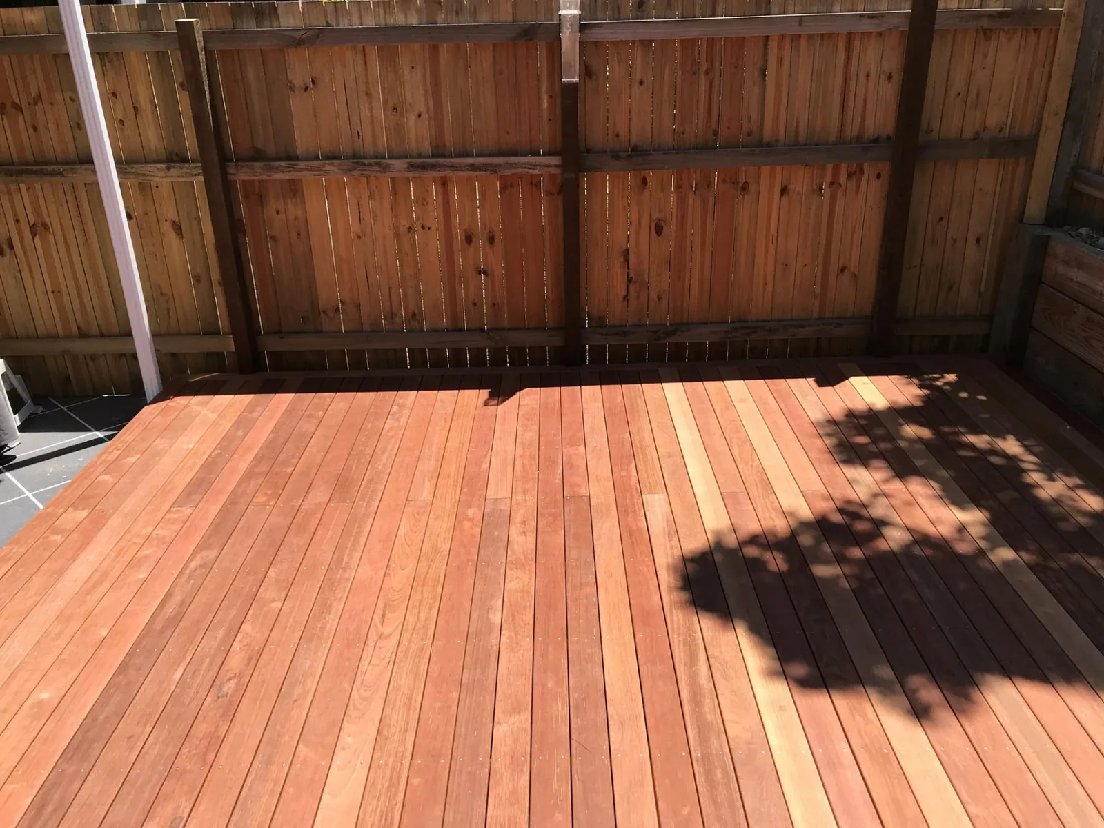 Timber deck against a new paling fence at the Parkinson property