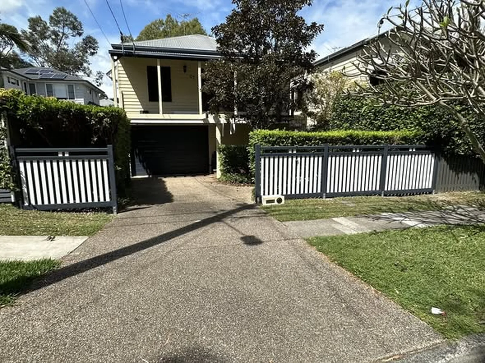 New painted timber front fence and driveway entrance in Norman Park